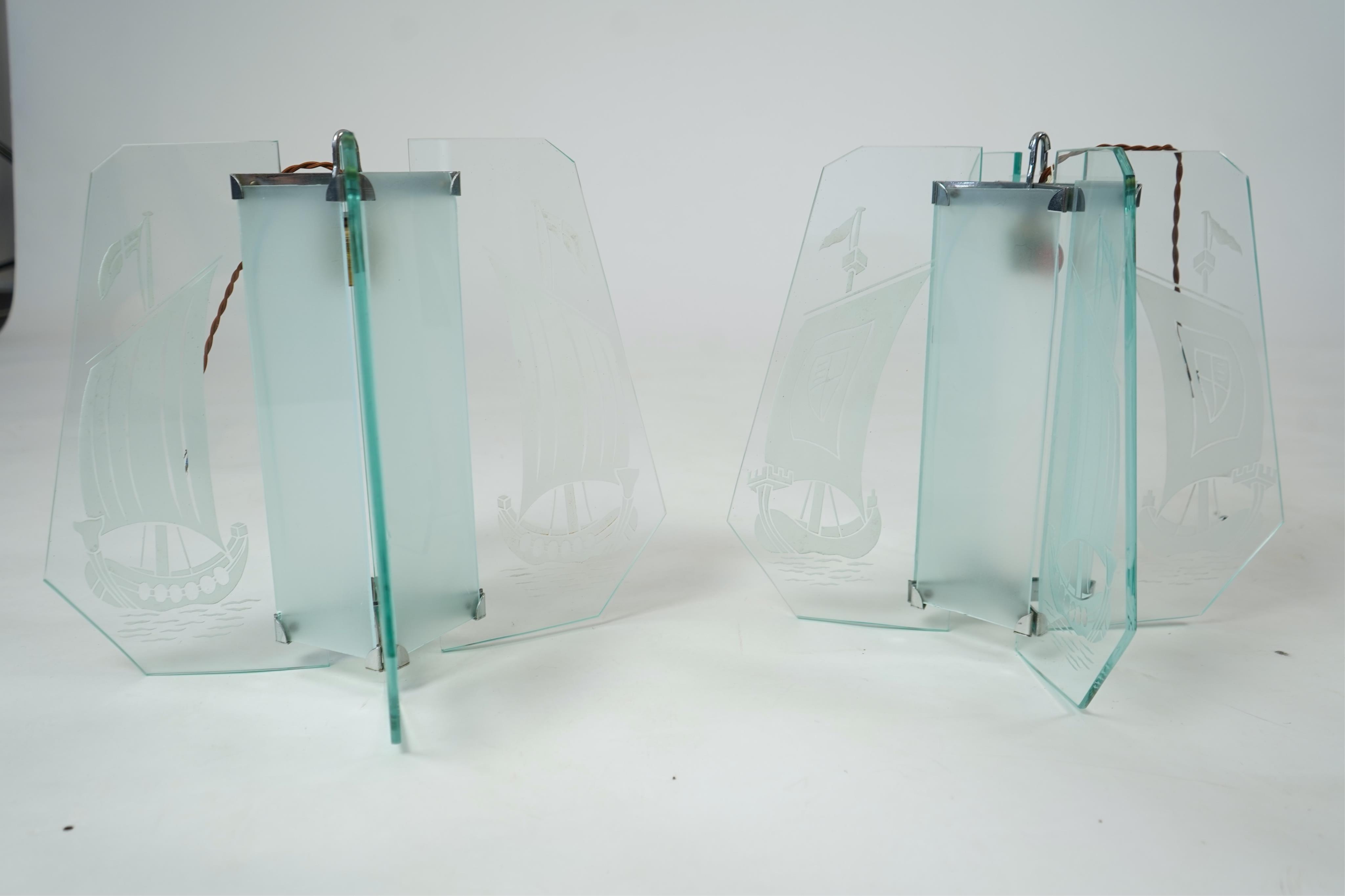 A pair of Art Deco chrome and four panelled etched glass ‘Galleon’ designed celling pendant lights